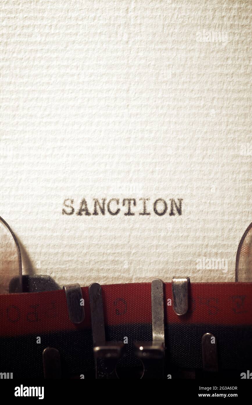 The word sanction written with a typewriter. Stock Photo