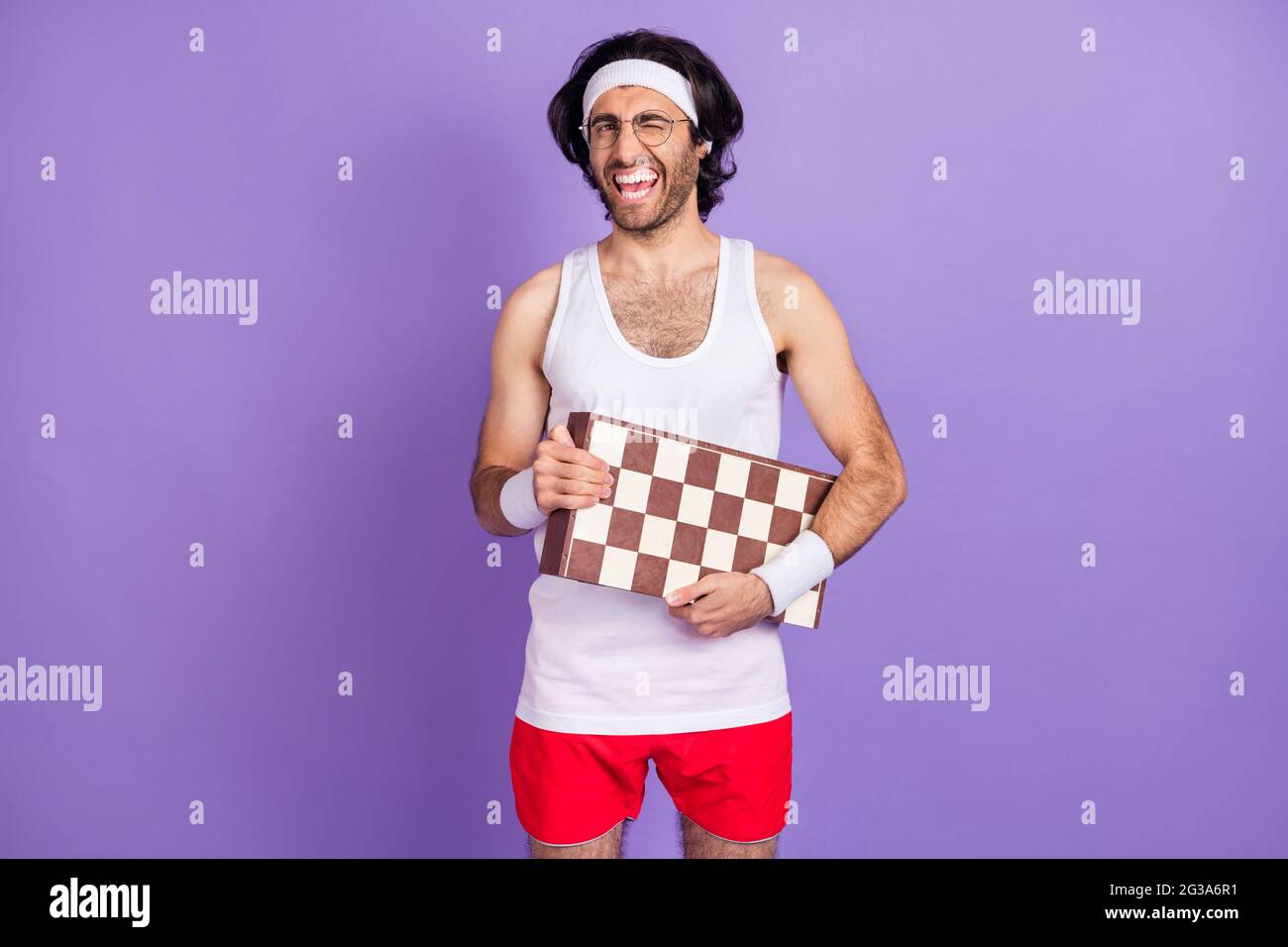 Photo Of Guy Hold Chess Board Blink Eye Open Mouth Wear Headband