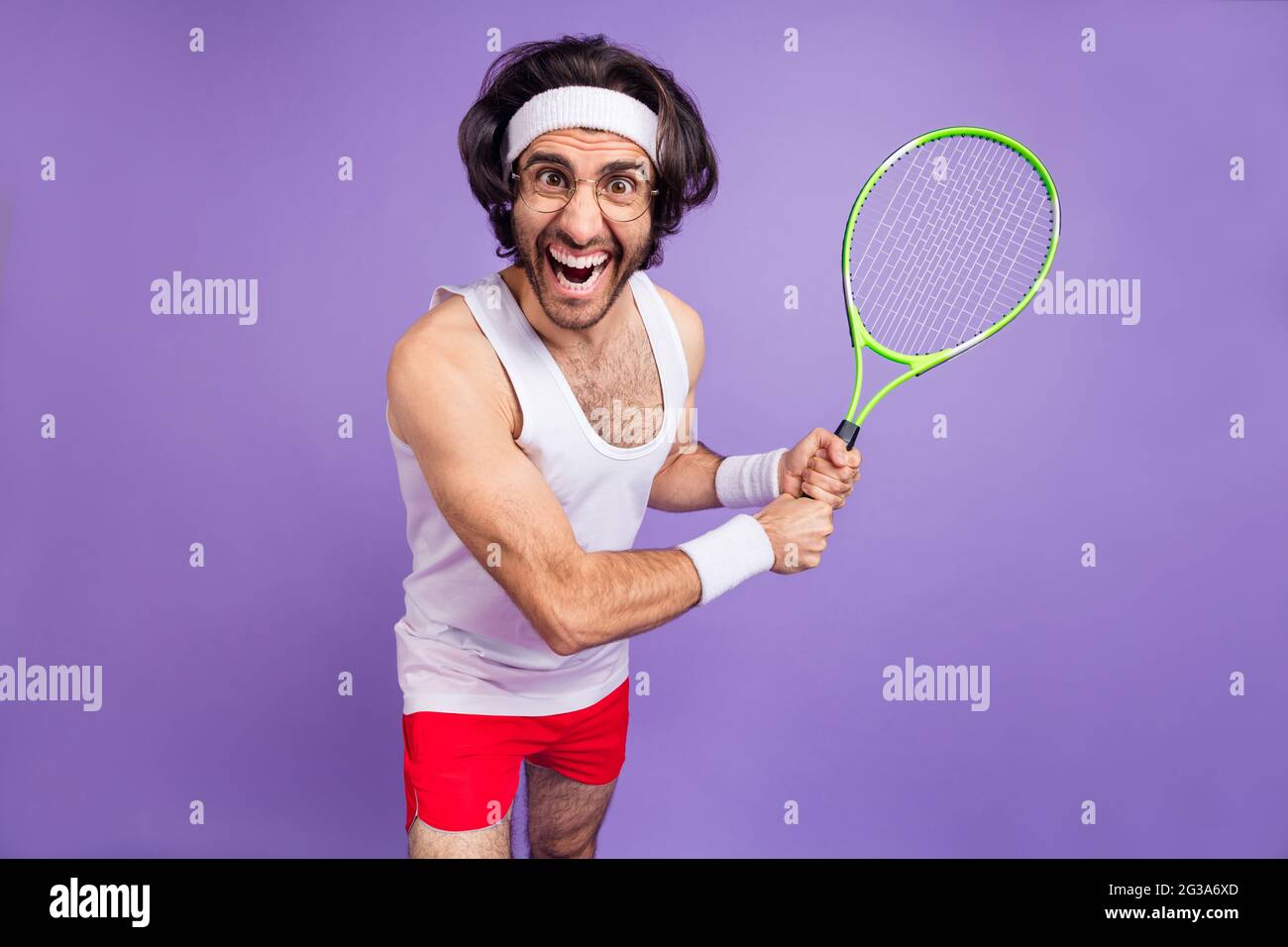 Photo of guy hold racket open mouth crazy face wear headband sportswear spectacles isolated violet background Stock Photo Alamy