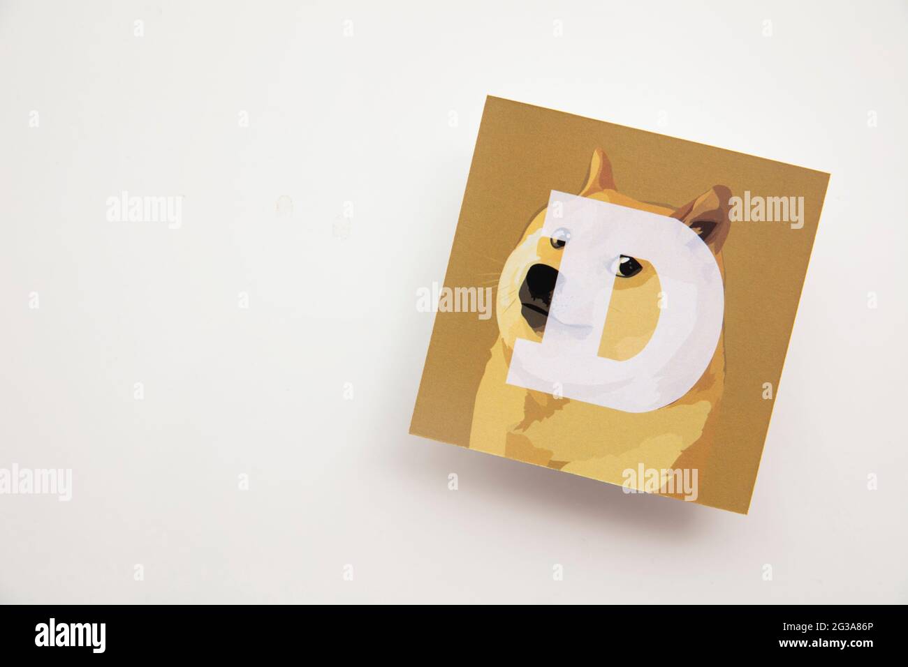 LONDON, UK - June 2021: Doge or dogecoin cryptocurrency logo on paper Stock  Photo - Alamy