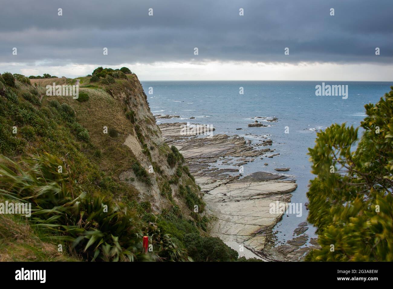 Kaikoura Peninsula Coastal Walkway, Marlborough region, New Zealand. Scenic views over the headland with moody grey sky Stock Photo