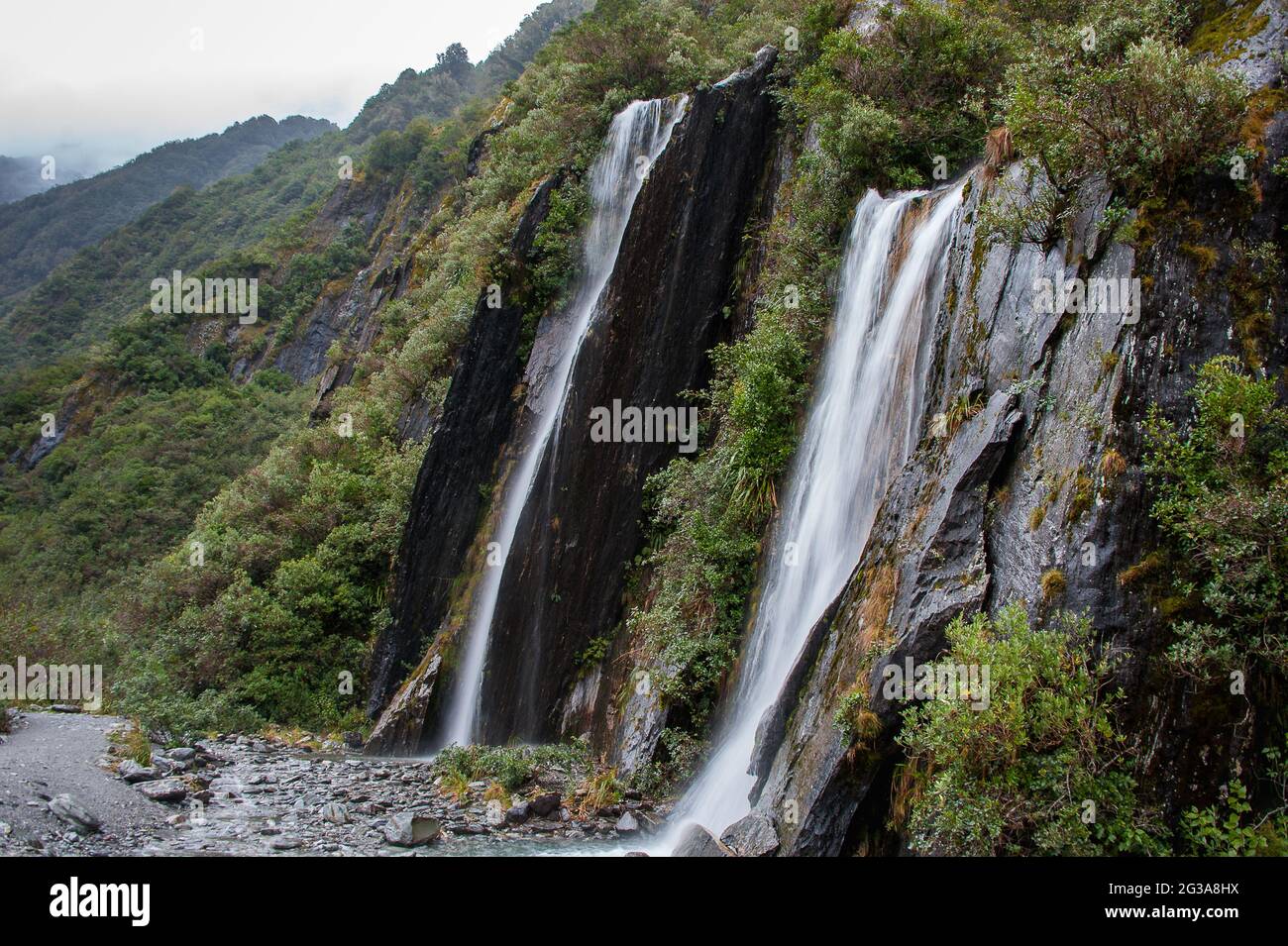 Beautiful waterfall, (with the unofficial name 'Trident Falls'), Franz Josef Glacier, New Zealand Stock Photo