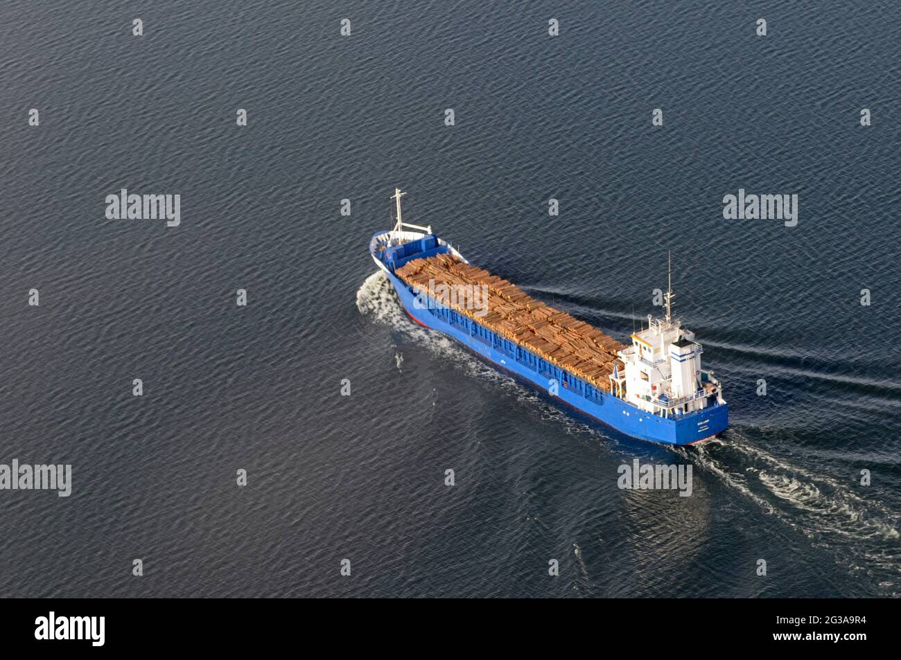 Freigh ship pictured in Kalmarsund Sweden with a load of timber visible. Stock Photo