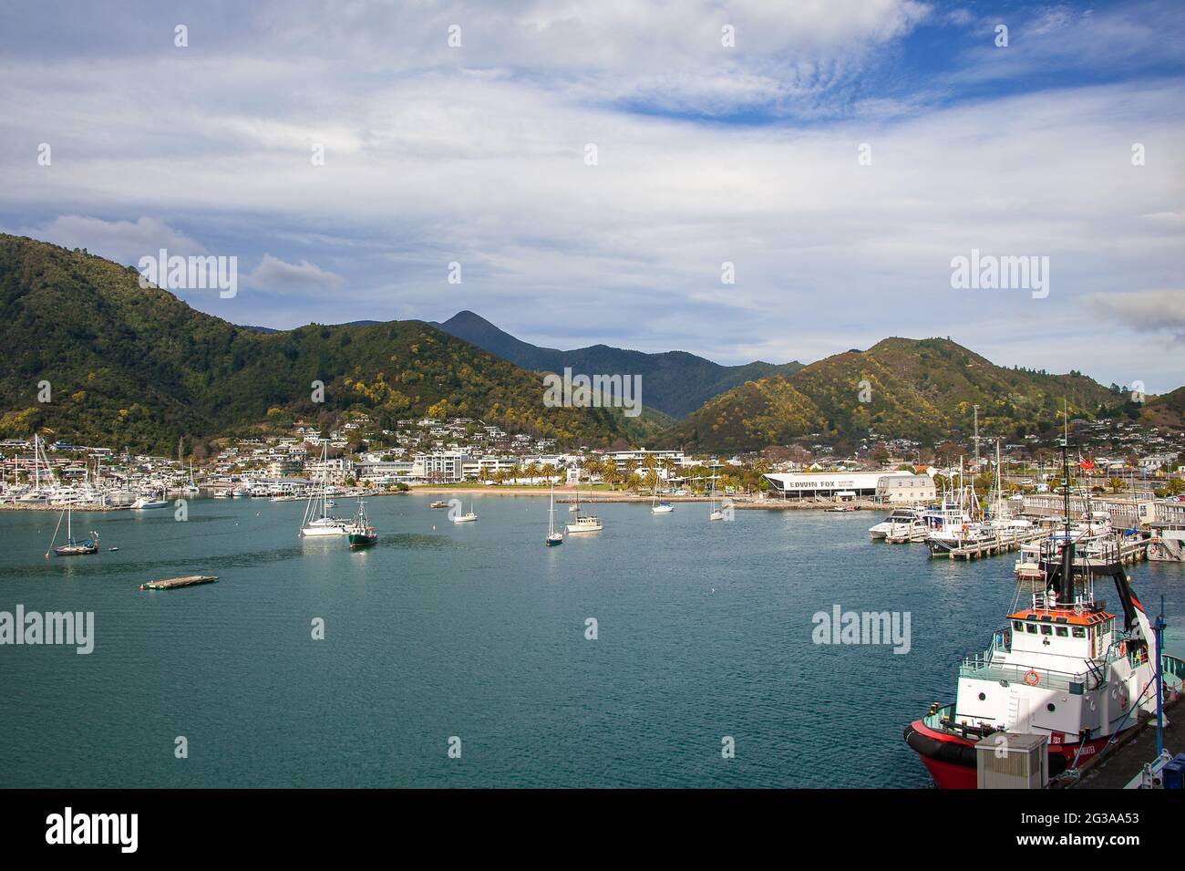 Picton, New Zealand : Fishing boats, Interislander ferry and leisure craft in Picton Port viewed from Queen Charlotte Drive. Panorama with mountains Stock Photo