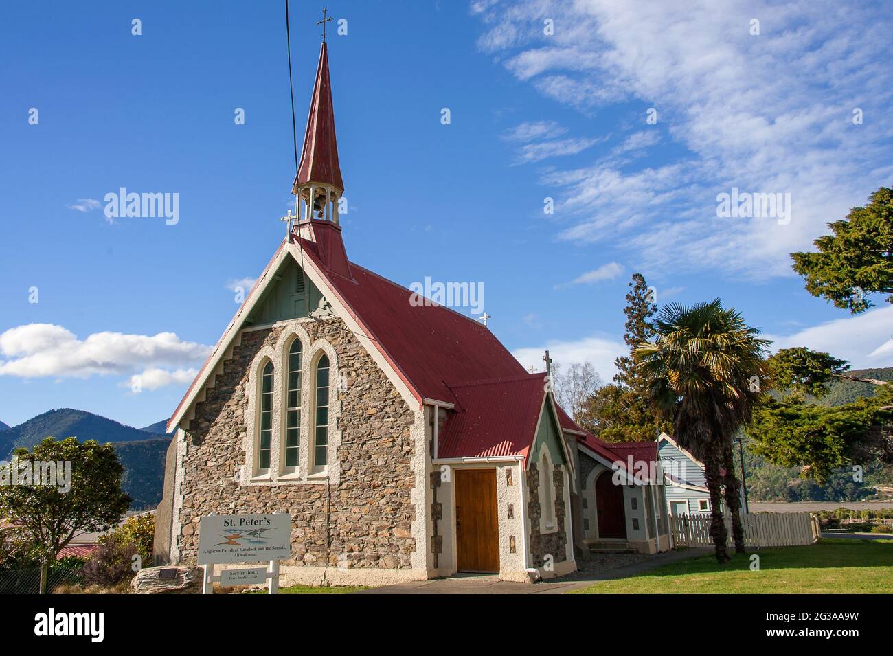 Havelock, New Zealand : St. Peter's Anglican Church, Havelock village, Marlborough, New Zealand. Old stone church with red roof in a rural landscape Stock Photo