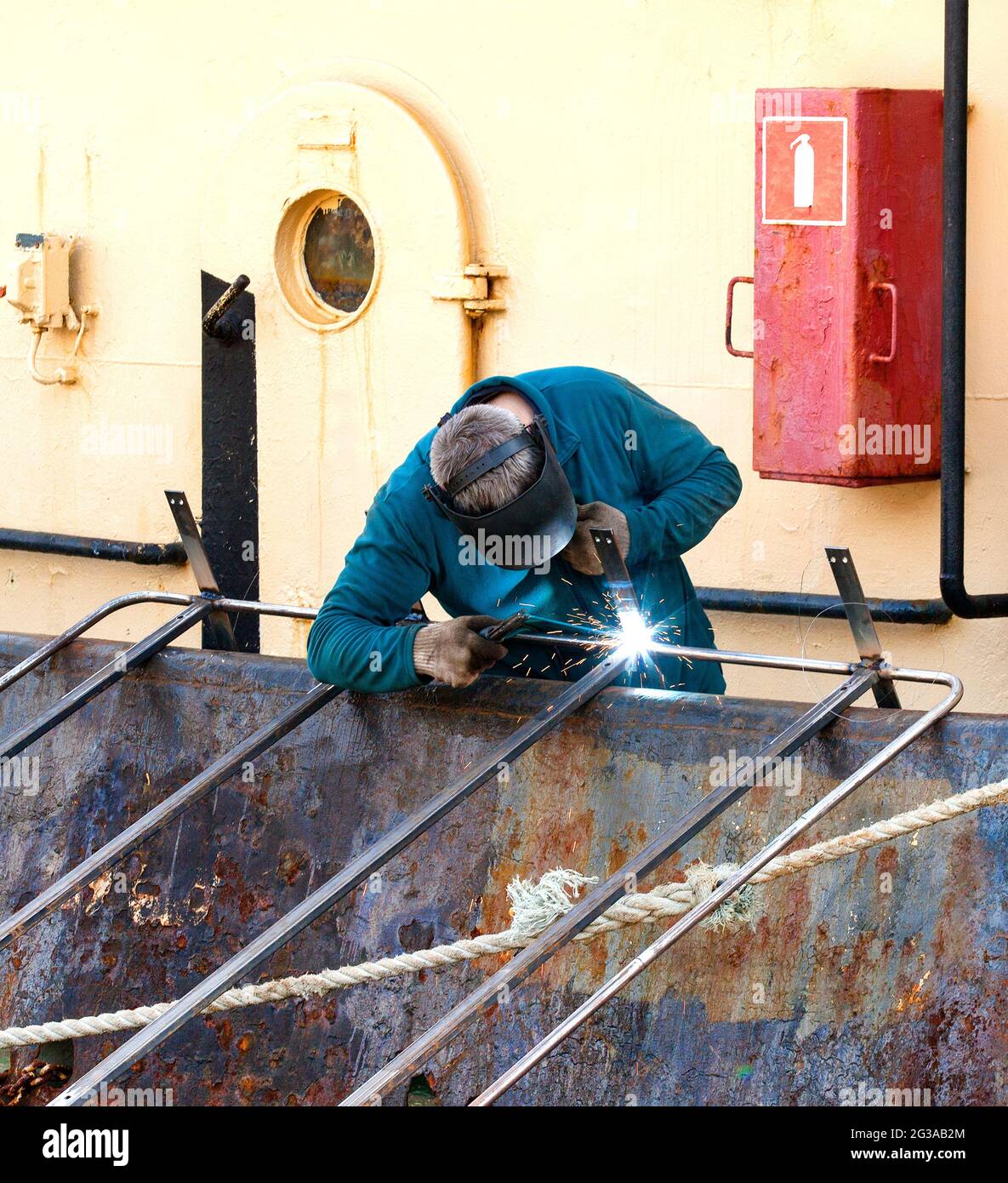 a welder working on a repair ship on Kamchatka Stock Photo