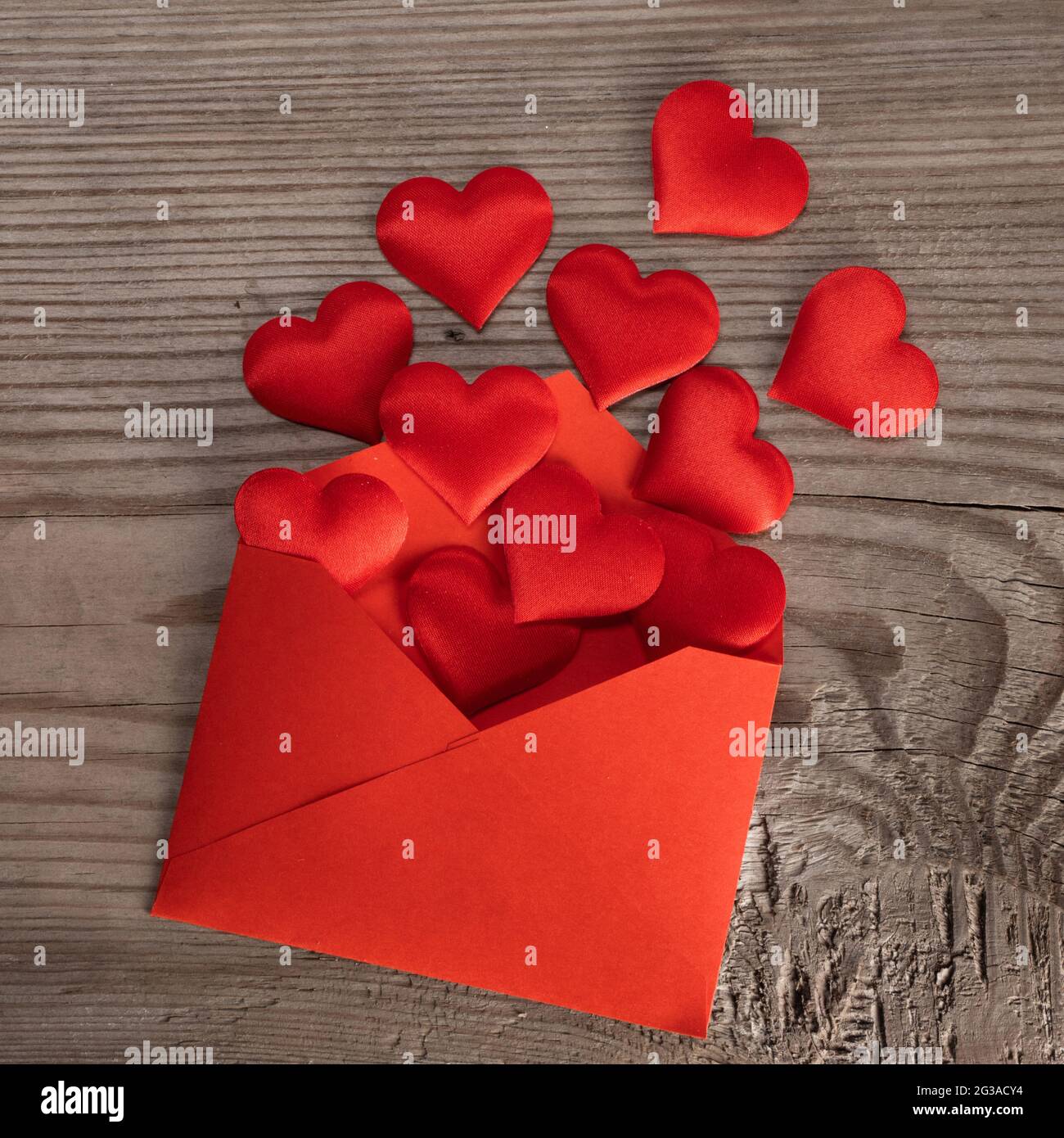 Valentine day love letter, envelope of craft red paper with red hearts ...