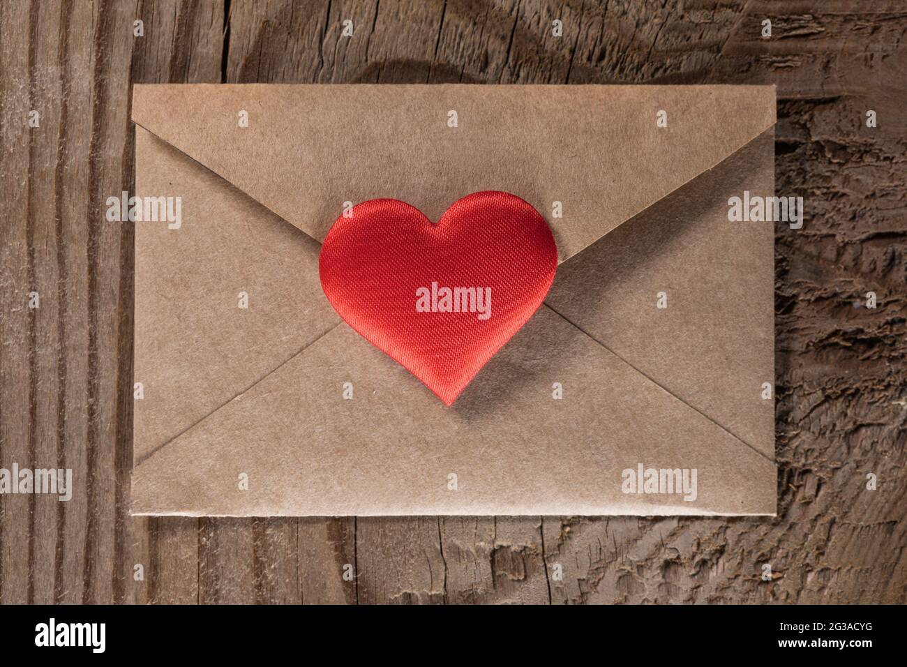 Valentine day love letter, envelope of craft paper with red heart on ...