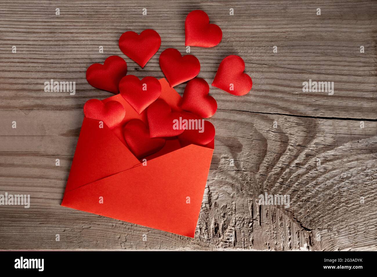 Valentine day love letter, envelope with red hearts heap spread on ...