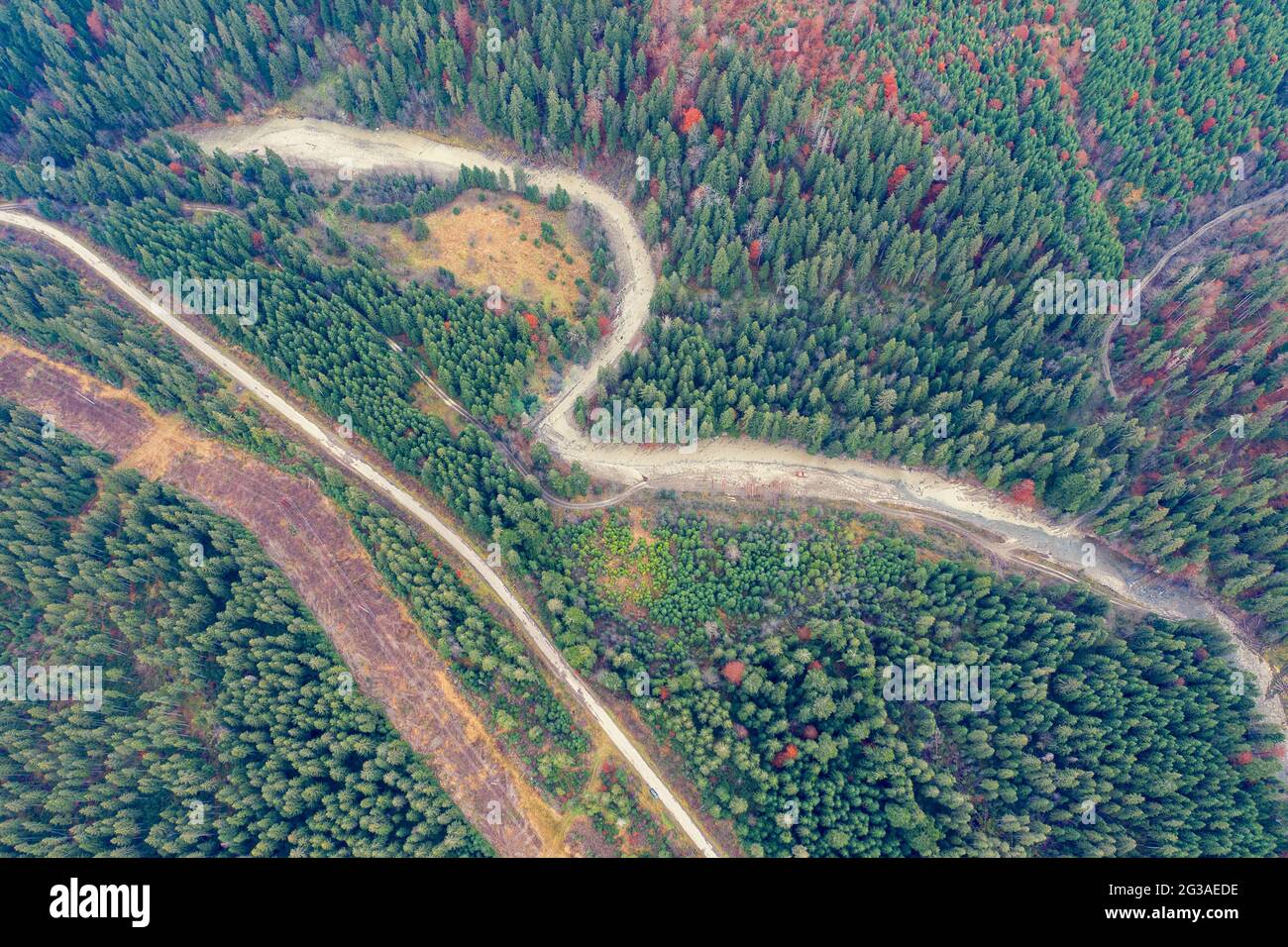 Aerial view of the mountains in autumn. The road along the winding river. Beautiful nature landscape. Prut River, Carpathian mountains. Ukraine Stock Photo