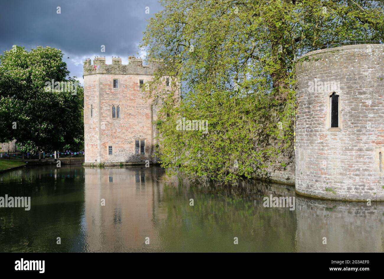 The gatehouse and part of the walls of the moated Bishop's Palace in Wells, Somerset, England Stock Photo