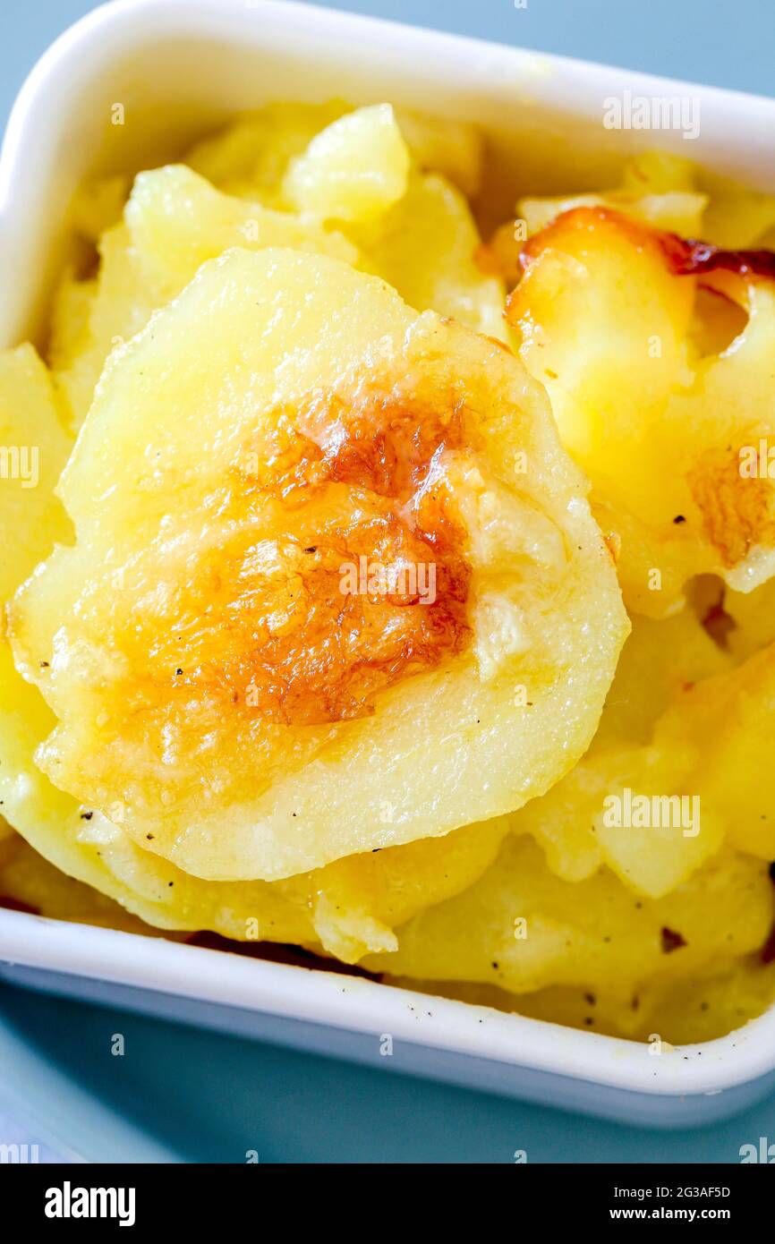 Dauphinoise Potatoes baked with Cream and Garlic in the Oven with a