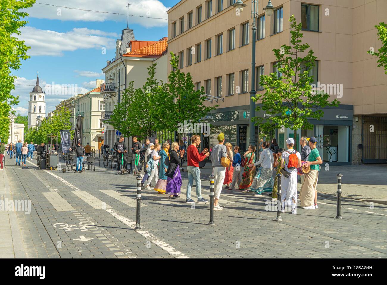 Hare Krishna members in main street Gediminas Avenue, 30 May 2021, Vilnius, Lithuania Stock Photo