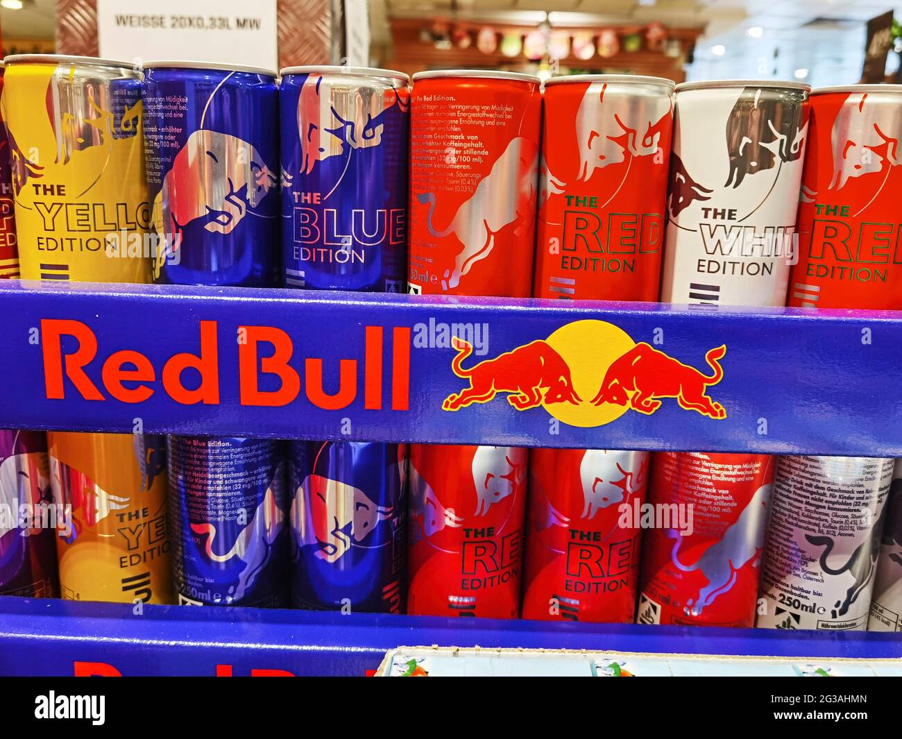Berlin, Germany - June 10, 2021: View to packages with colorful cans of the  energy drink Red Bull Stock Photo - Alamy