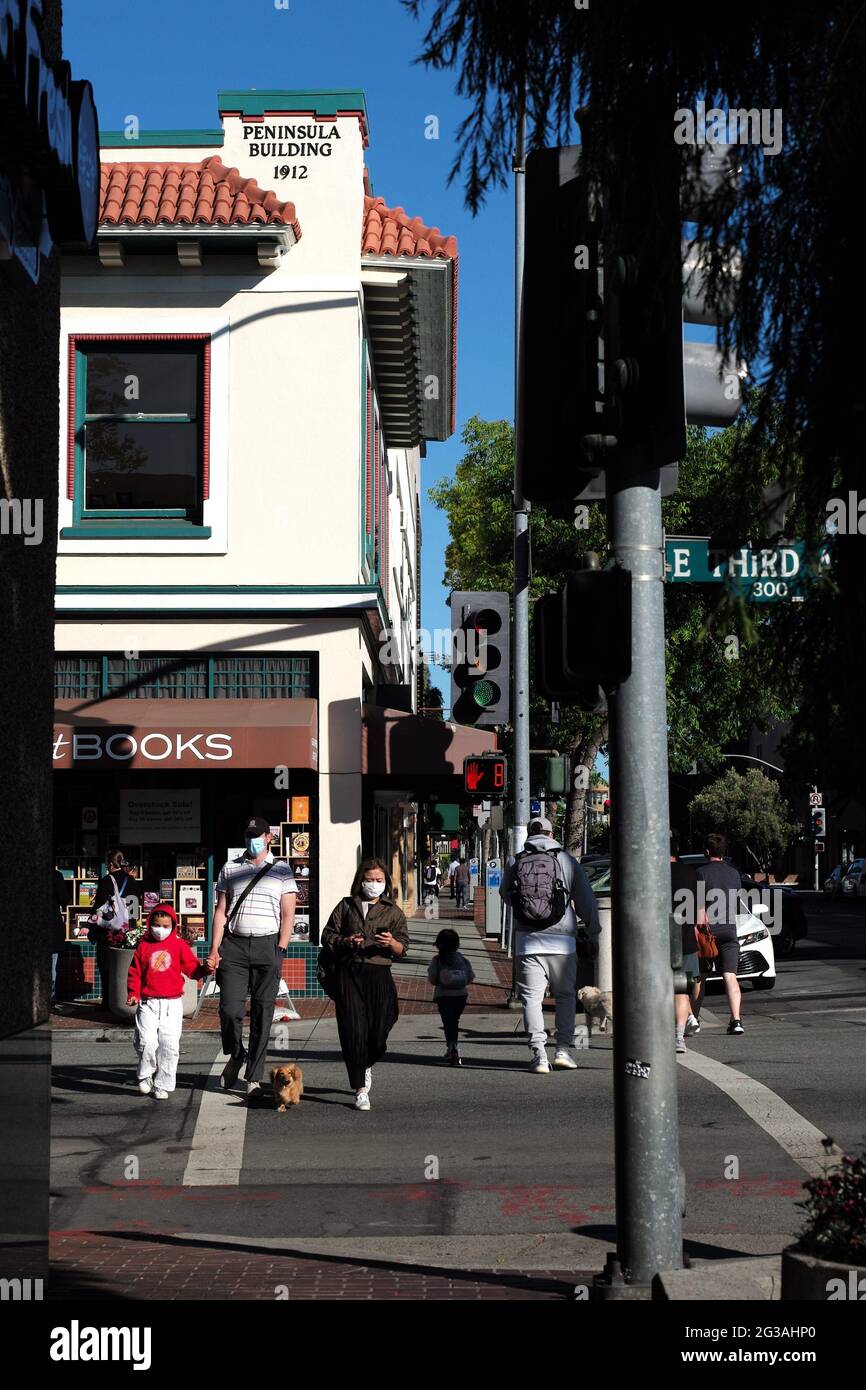 San Mateo, USA. 14th June, 2021. People walk on the street in San Mateo,  California, the United States, June 14, 2021. California Governor Gavin  Newsom and government health officials announced the official