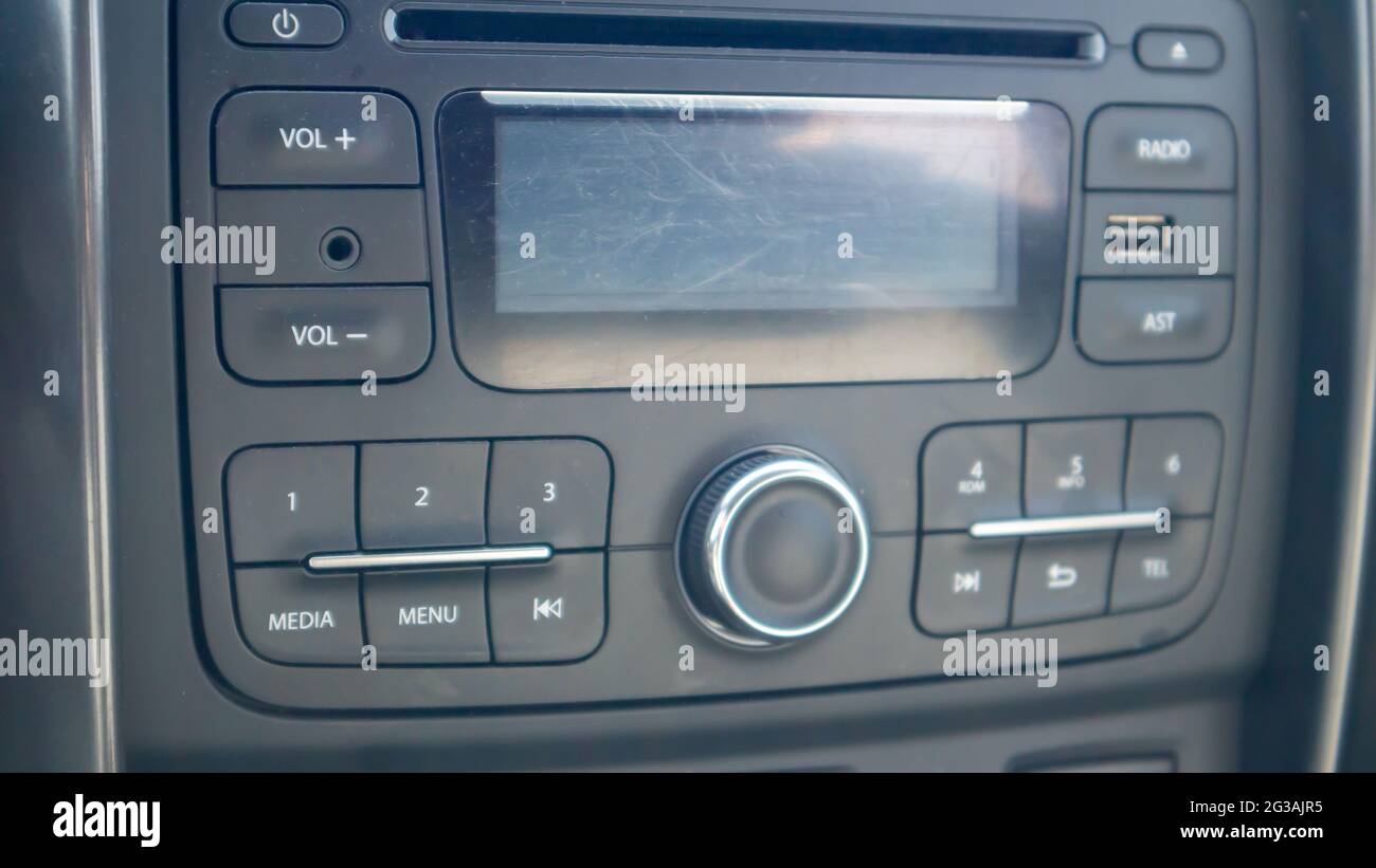 Established multimedia in the car. Closeup of the head unit and radio