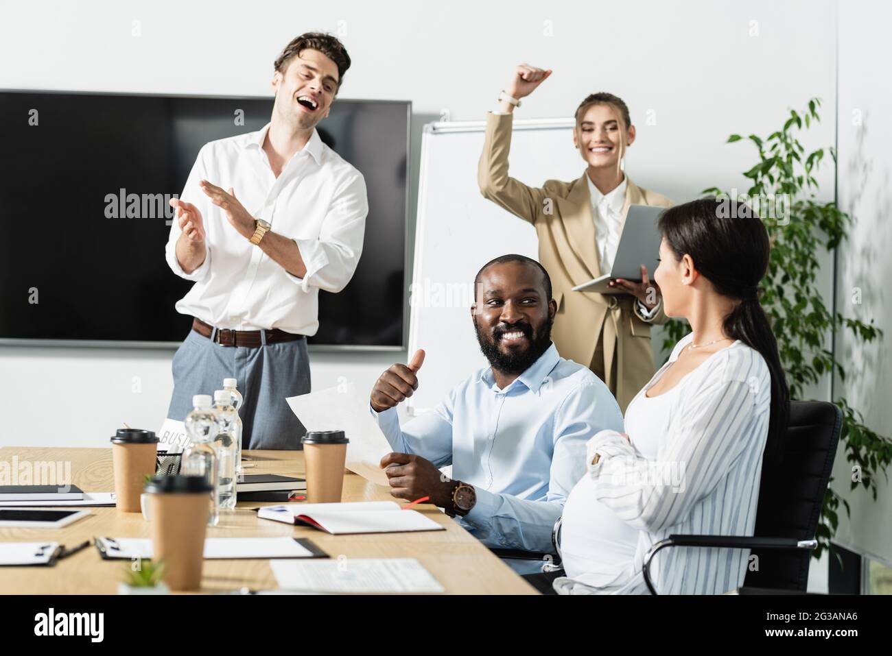 happy business people celebrating triumph in conference room Stock ...