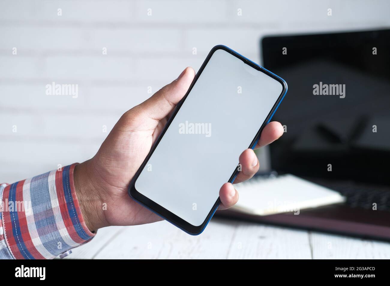 Close up of young man hand using smart phone with empty screen Stock ...
