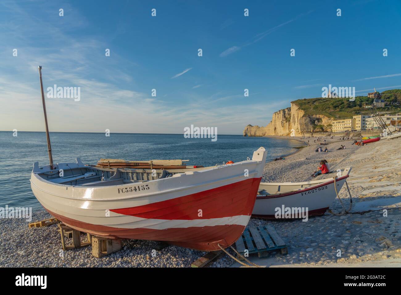 Boats beach etretat sunset hi-res stock photography and images - Alamy