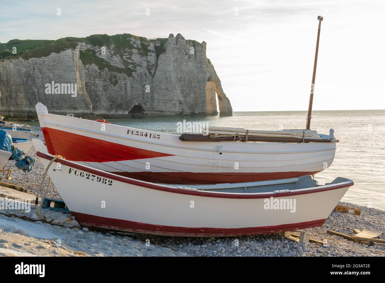 Boats beach etretat sunset hi-res stock photography and images - Alamy