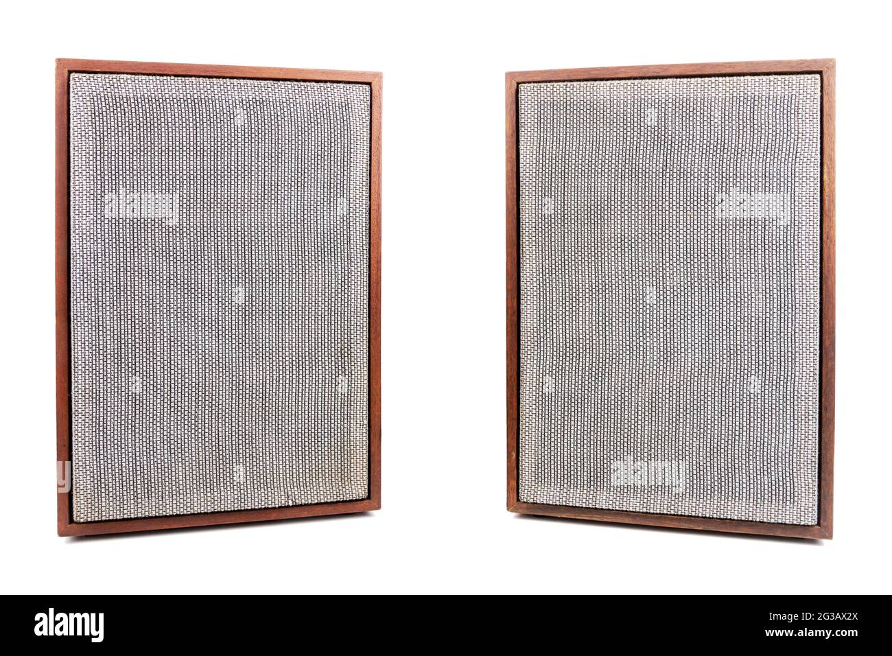 Two vintage speakers with fabric grills isolated on white background