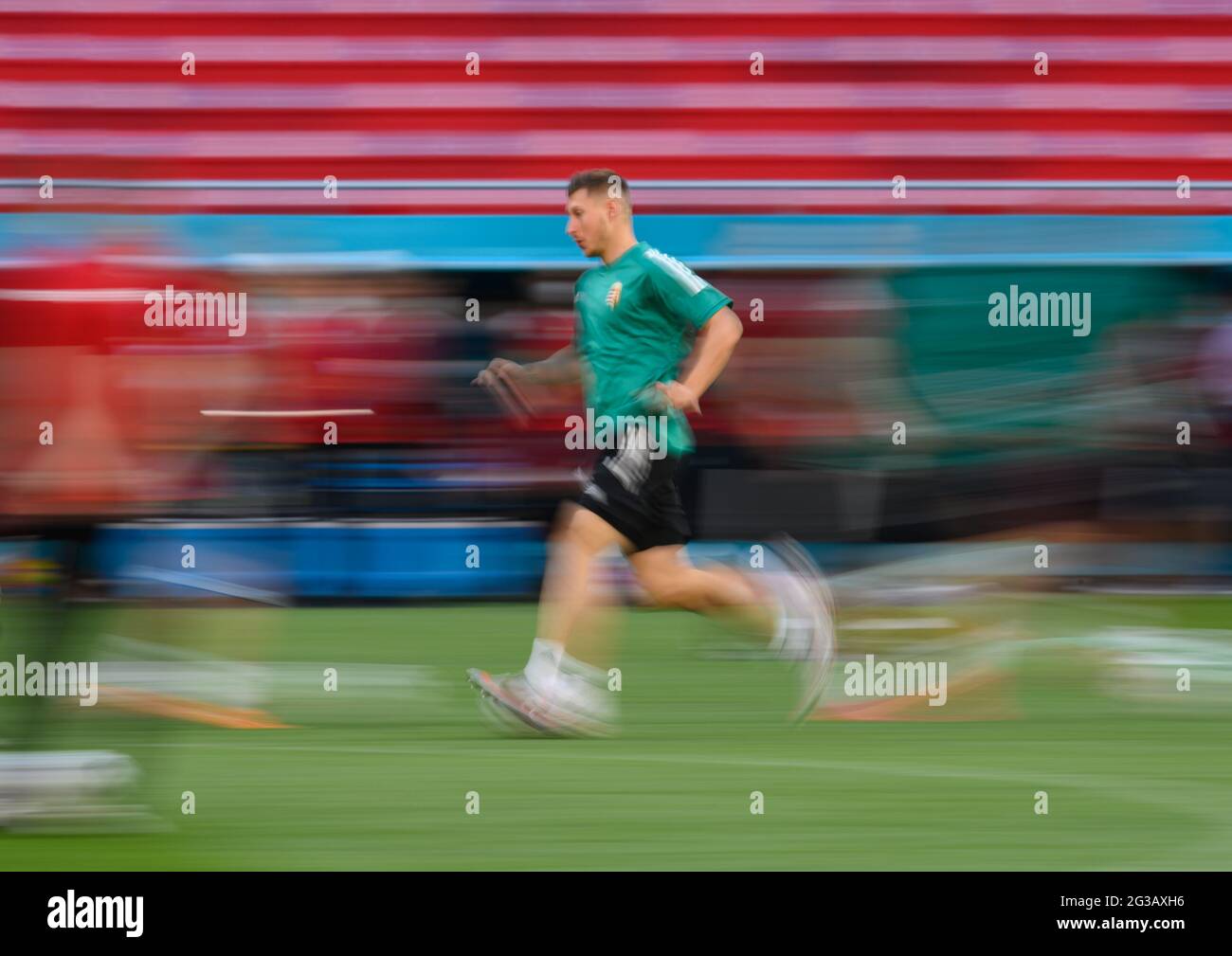 Budapest, Hungary. 14th June, 2021. Football: European Championship, Group F, before the match Hungary - Portugal, final training of Hungary in the Puskas Arena. Willi Orban runs across the field. (Shot with long exposure time) Credit: Robert Michael/dpa-Zentralbild/dpa/Alamy Live News Stock Photo