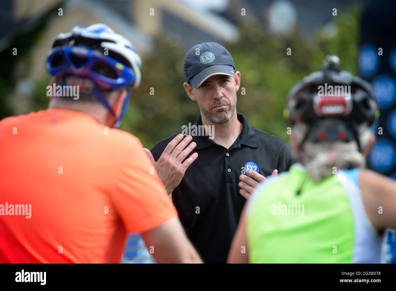 UNITED STATES - June 13, 2021: Andy Bacon EX2 Adventures ride promoter talks with riders about rules of the course. The Loudoun 1725 Gravel Grinder is Stock Photo