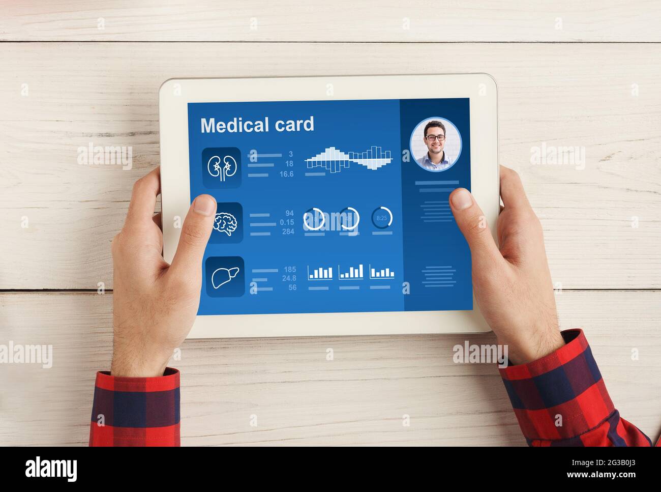 Cropped Of Man Using Modern Digital Tablet Reading Medical Card Checking His Health Condition Or Reading Anamnesis Wooden Desk Background Online M Stock Photo Alamy