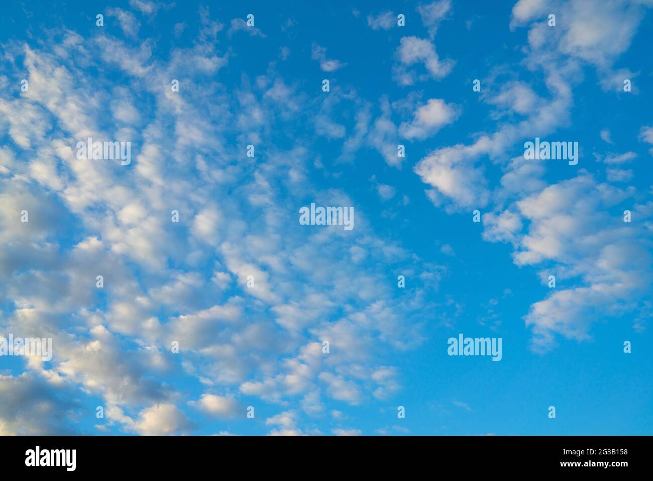 Beautiful bright blue sky with fluffy clouds Stock Photo - Alamy