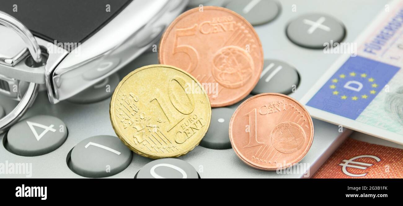 Calculator and 16 Cent with German driving licence Stock Photo