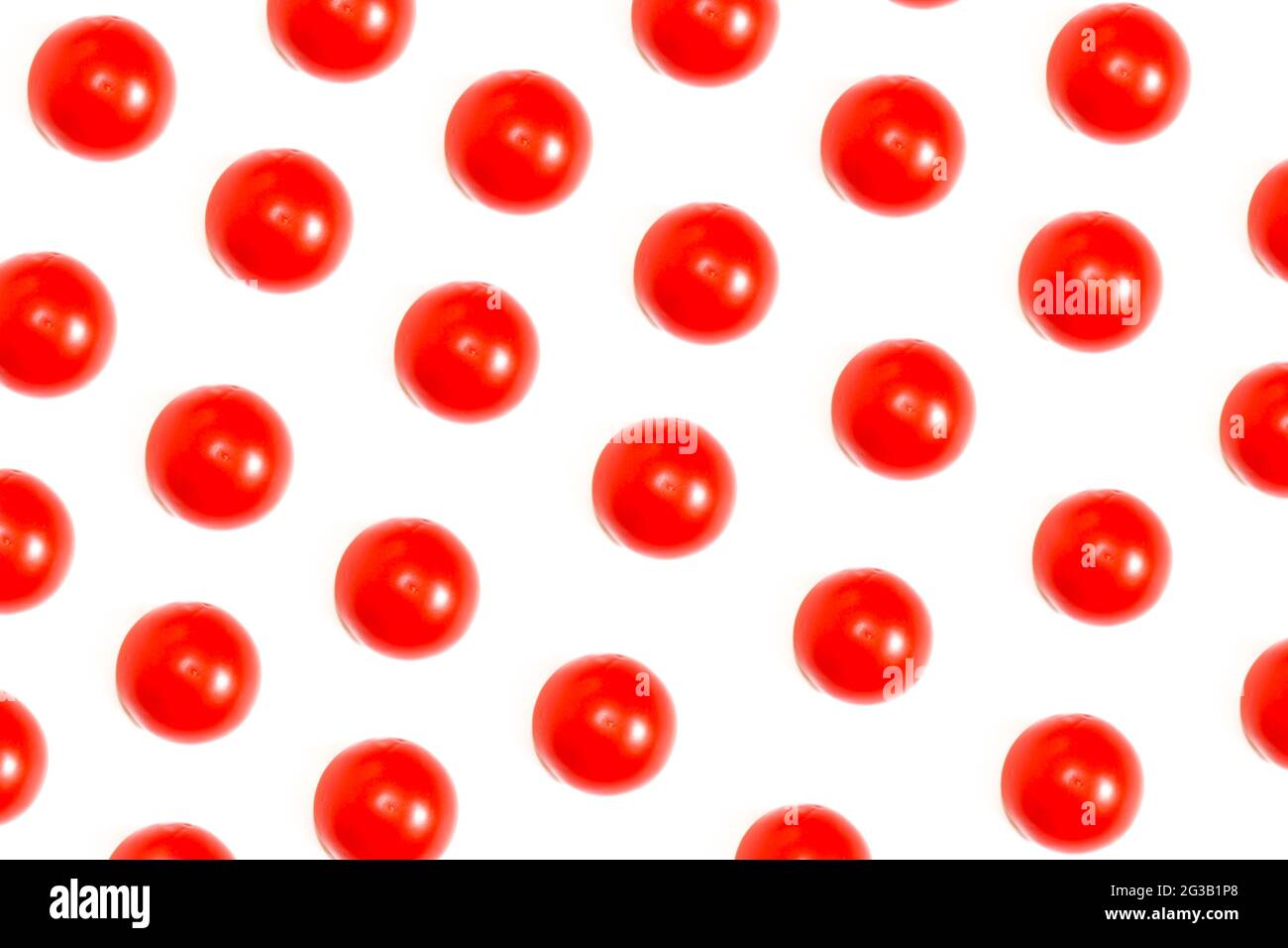 Tomatoes creative pattern background, ripe tomatoes isolated on white, top view. Stock Photo