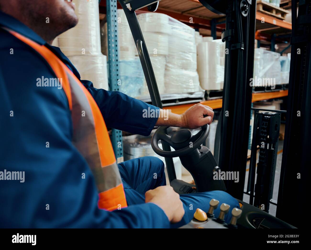 Close-up of a warehouse worker operating forklift truck Stock Photo