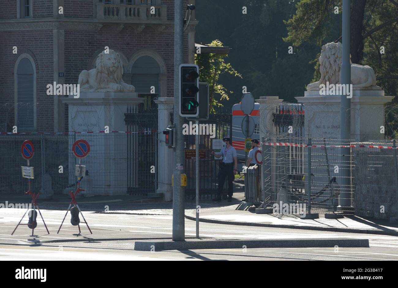 Geneva, Switzerland. 15th June, 2021. Security officers stand guard at an entrance to the Villa La Grange, the venue for the upcoming Biden-Putin summit, in Geneva, Switzerland, on June 15, 2021. U.S. President Joe Biden and his Russian counterpart Vladimir Putin are set to meet in the Swiss city of Geneva on Wednesday, which will be the two leaders' first face-to-face meeting since the Biden administration took office on Jan. 20. Credit: Guo Chen/Xinhua/Alamy Live News Stock Photo