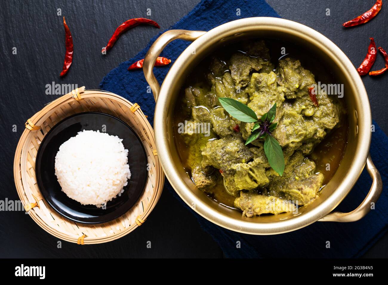 Food concept Thai coconut milk Green curry beef on black background with copy space Stock Photo