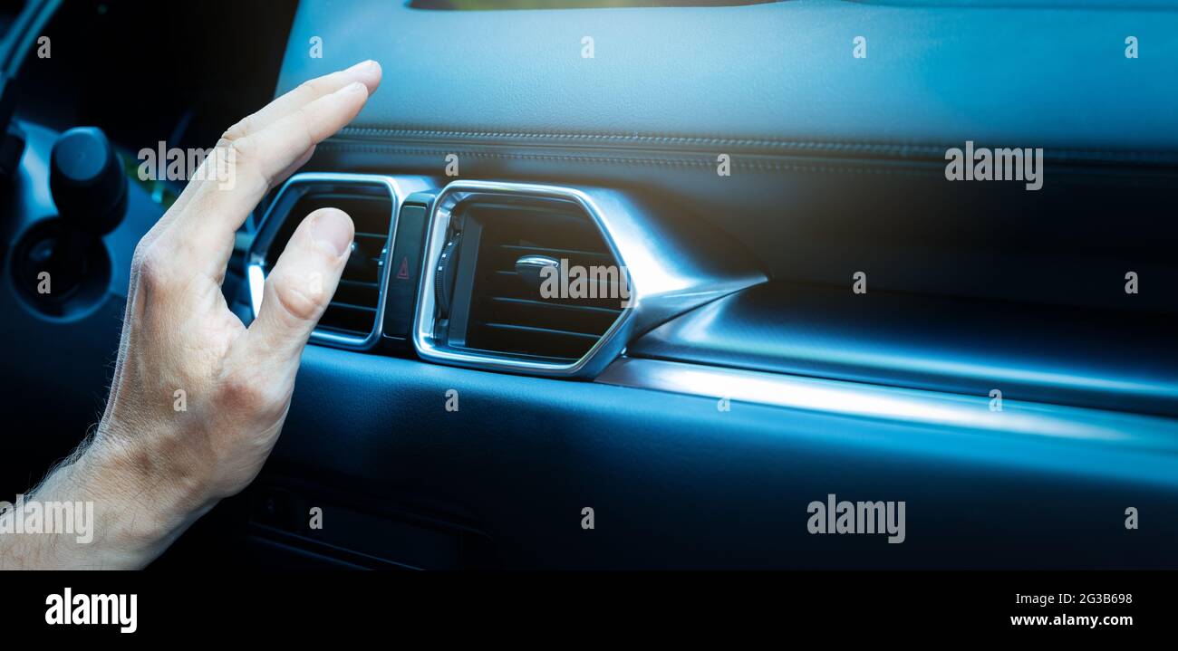 hand checking air conditioner in car. climate control. copy space Stock Photo