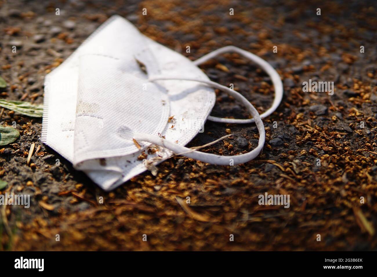 Environmental pollution with disposable FFP2 mask Stock Photo Alamy