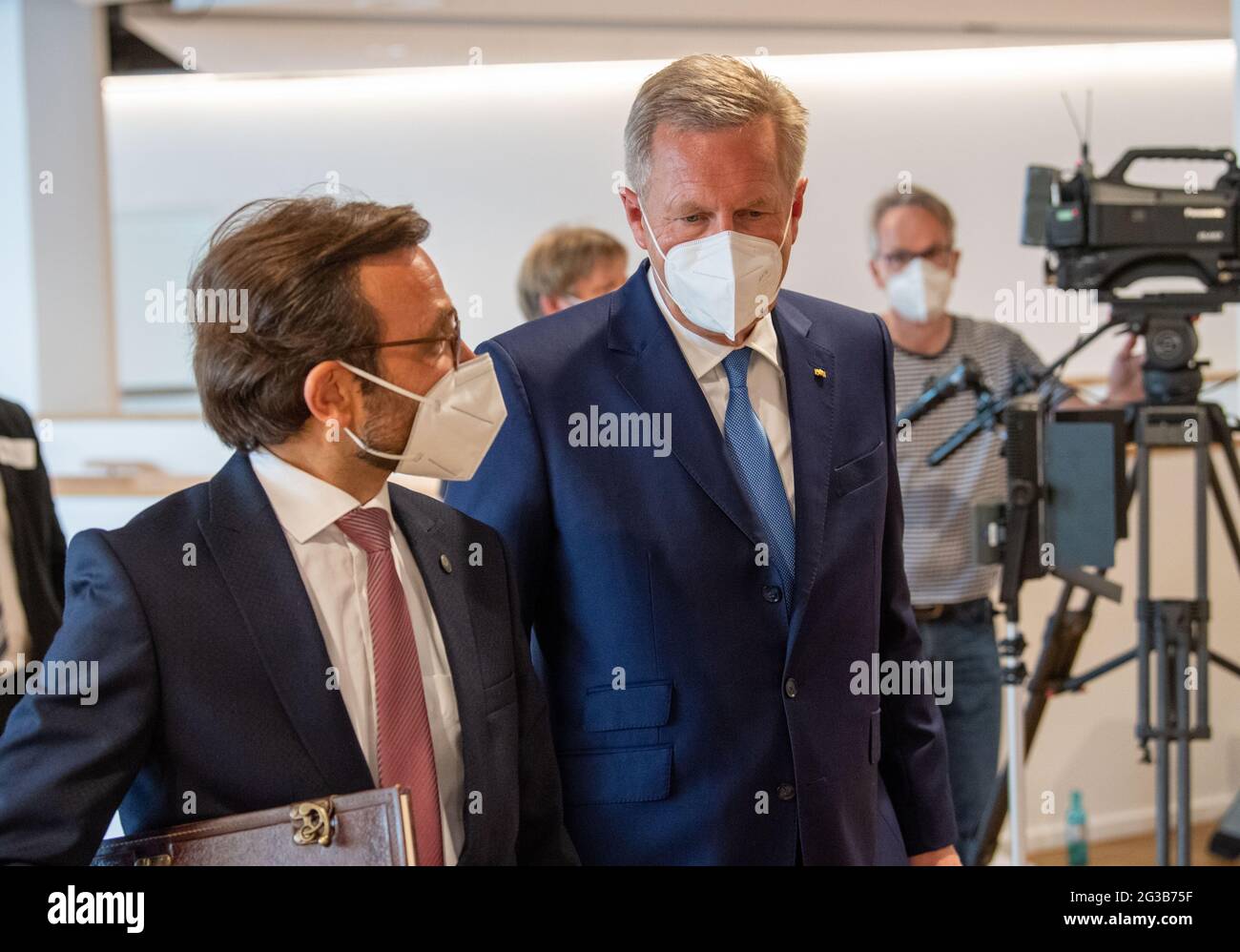 15 June 2021, Lower Saxony, Osnabrück: Christian Wulff (r), former Federal President of Germany, speaks with Bülent Ucar, theologian, after the press conference for the opening of the Islam College. The Islam-Kolleg was ceremonially opened in Osnabrück. Photo: Lino Mirgeler/dpa Stock Photo