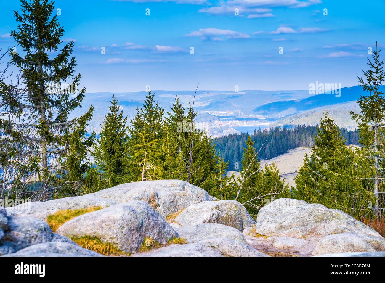 Germany, Panorama view dreiseenblick  above schwarzwald nature landscape, tree tops from mountain feldberg into titisee neustadt city and lake water Stock Photo