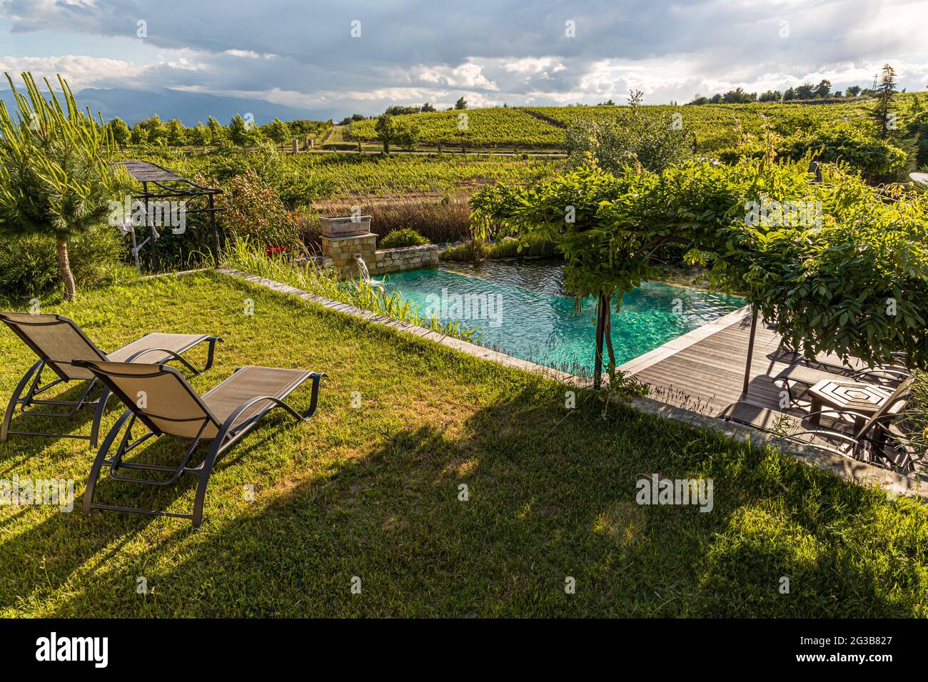 In the area between the six villas, which belongs to the Zornitza Family Estate, a pool is fed from the natural thermal spring. Lozenitsa, Sandanski, Bulgaria Stock Photo