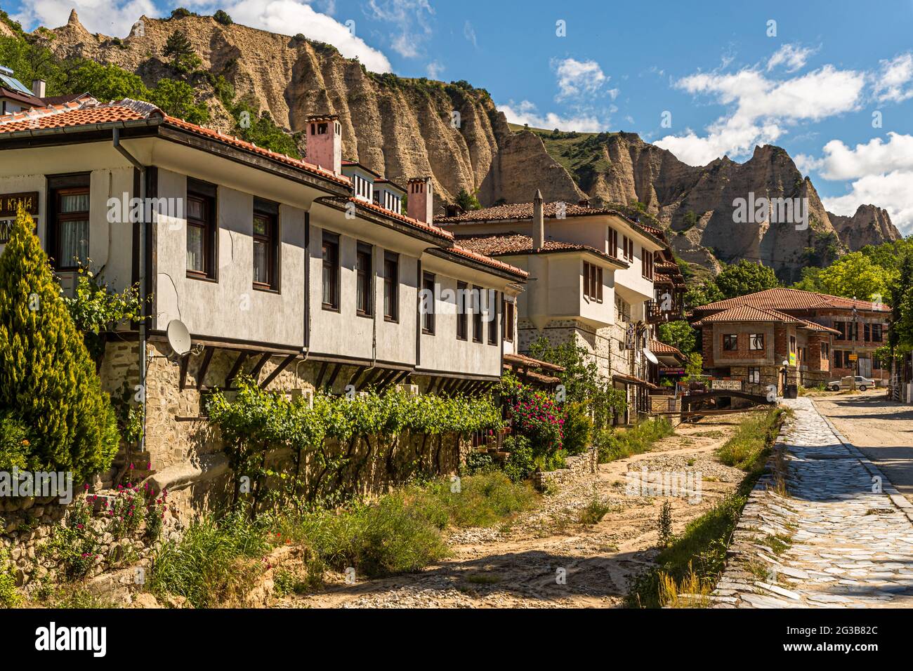 With 160 inhabitants, the town of Melnik is considered the smallest town in Bulgaria. The houses are characterized by the architecture of the Bulgarian National Revival style with cantilevered residential upper floors and a floor below, where the wine can mature at a constant cool temperature Stock Photo