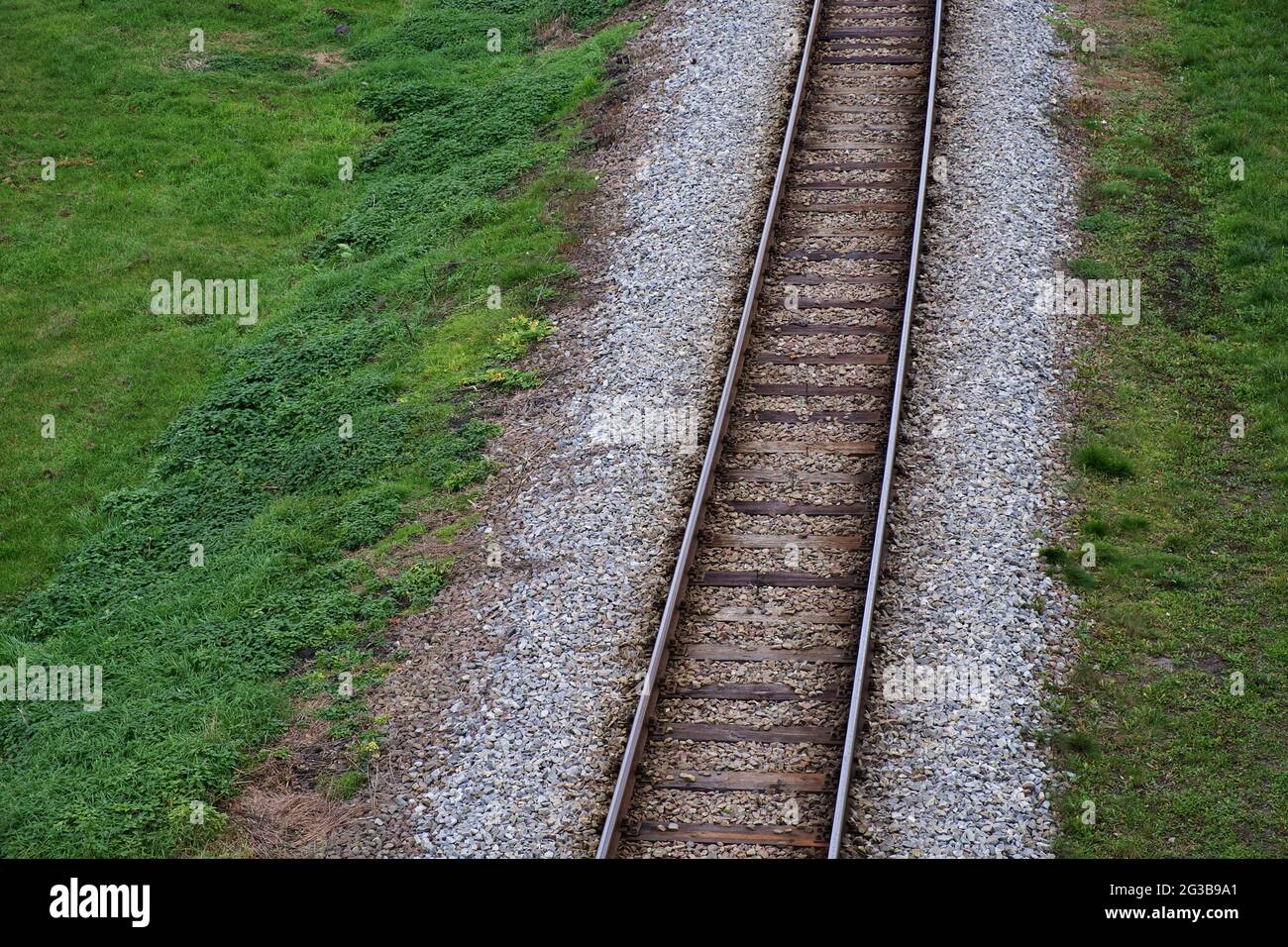 Railway bed. Fragment of railway tracks, top view, rails and sleepers