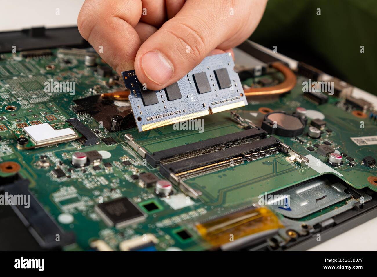 installing RAM in a laptop, laptop repair. Stock Photo