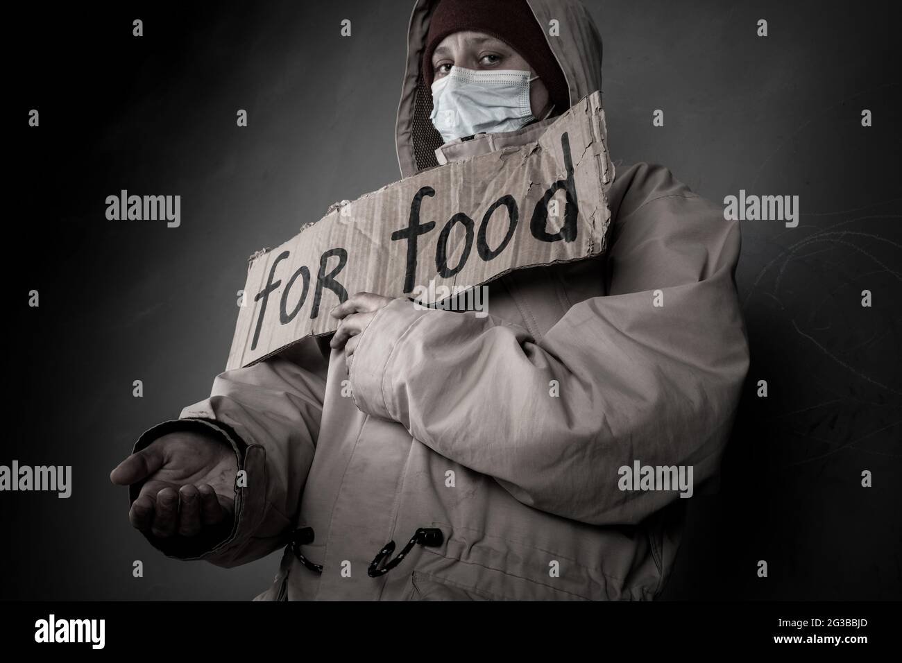 homeless poor beggar asks for help and food ,unemployed in despair. Stock Photo