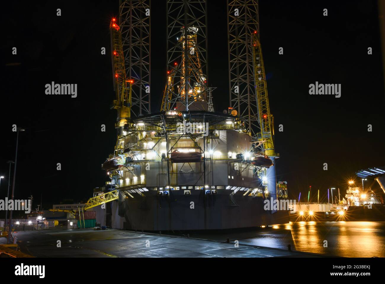 Den Helder, the Netherlands. November 2019. Harbour vibes. An oilrig and a supplier by night in the harbour of Den Helder, the Netherlands. High quality photo Stock Photo