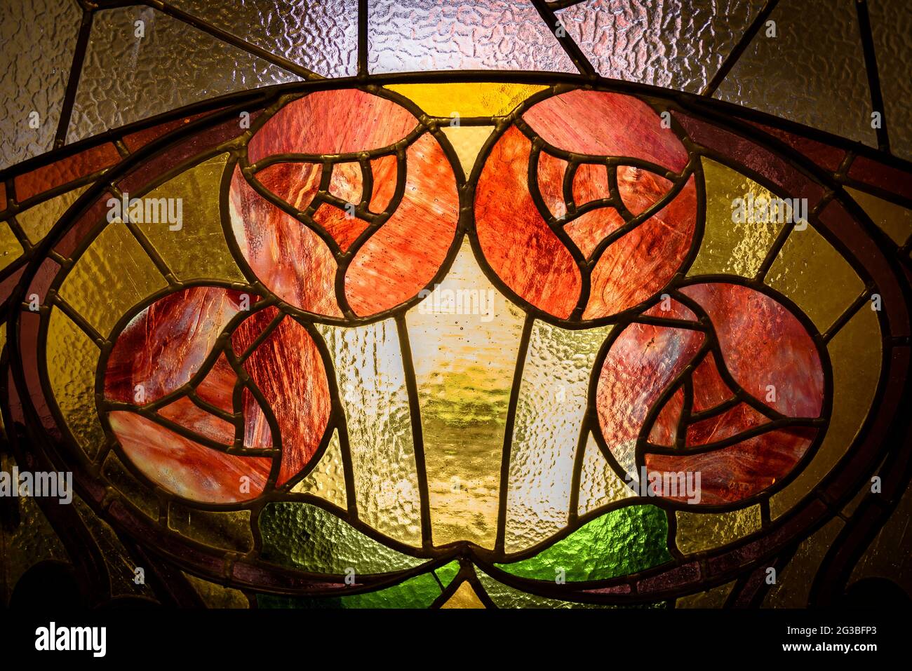 Some stained glass windows of the entrance door in the modernist house of Can Raspall, in La Garriga (Vallès Oriental, Barcelona, Catalonia, Spain) Stock Photo