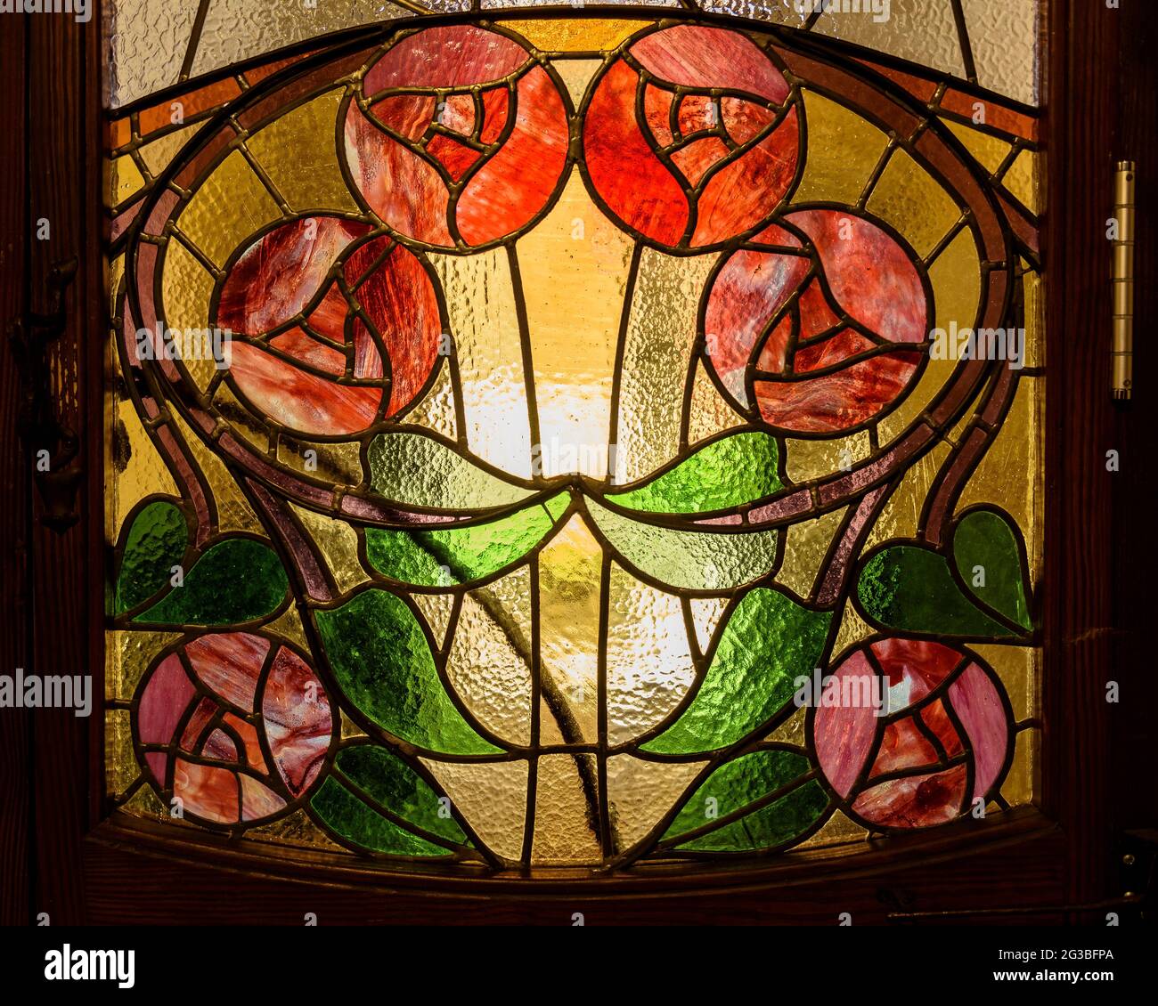 Some stained glass windows of the entrance door in the modernist house of Can Raspall, in La Garriga (Vallès Oriental, Barcelona, Catalonia, Spain) Stock Photo