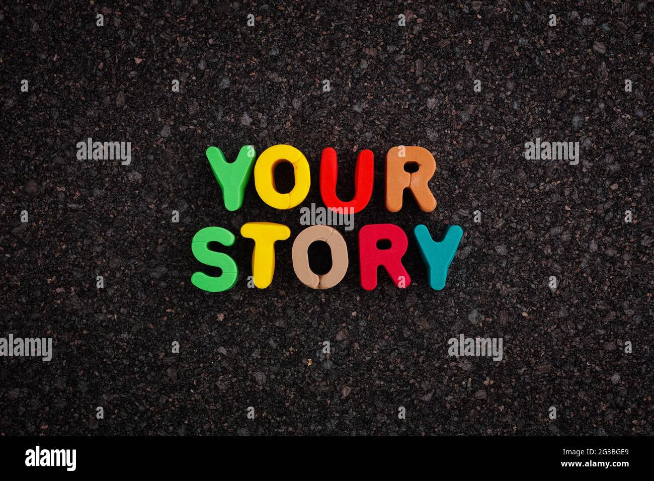 The phrase Your Story on a dark cork board. Close up. Stock Photo