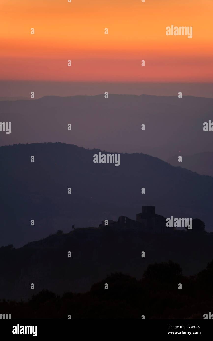 Tagamanent mountain at sunset seen from Pla de la Calma plain in Montseny (Barcelona, Vallès Oriental, Catalonia, Spain) Stock Photo