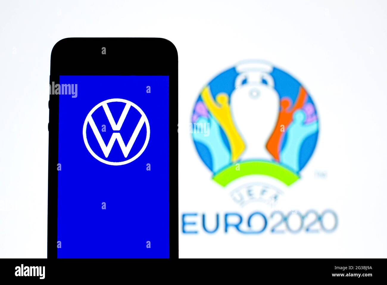 Spain. 15th June, 2021. In this photo illustration a Volkswagen logo seen displayed on a smartphone with a UEFA Euro 2020 logo in the background. (Photo by Thiago Prudencio/SOPA Images/Sipa USA) Credit: Sipa USA/Alamy Live News Stock Photo
