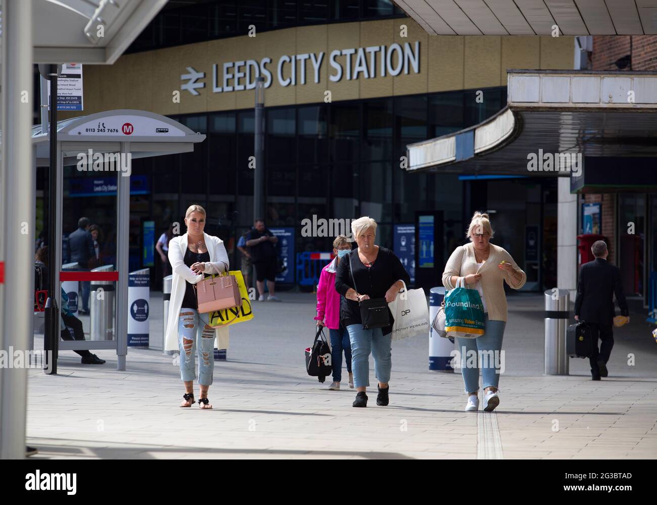 People walking out of of Leeds city train station which has seen a dramatic fall in footfall since the covid19 pandemic.. Leeds is a city centre which Stock Photo
